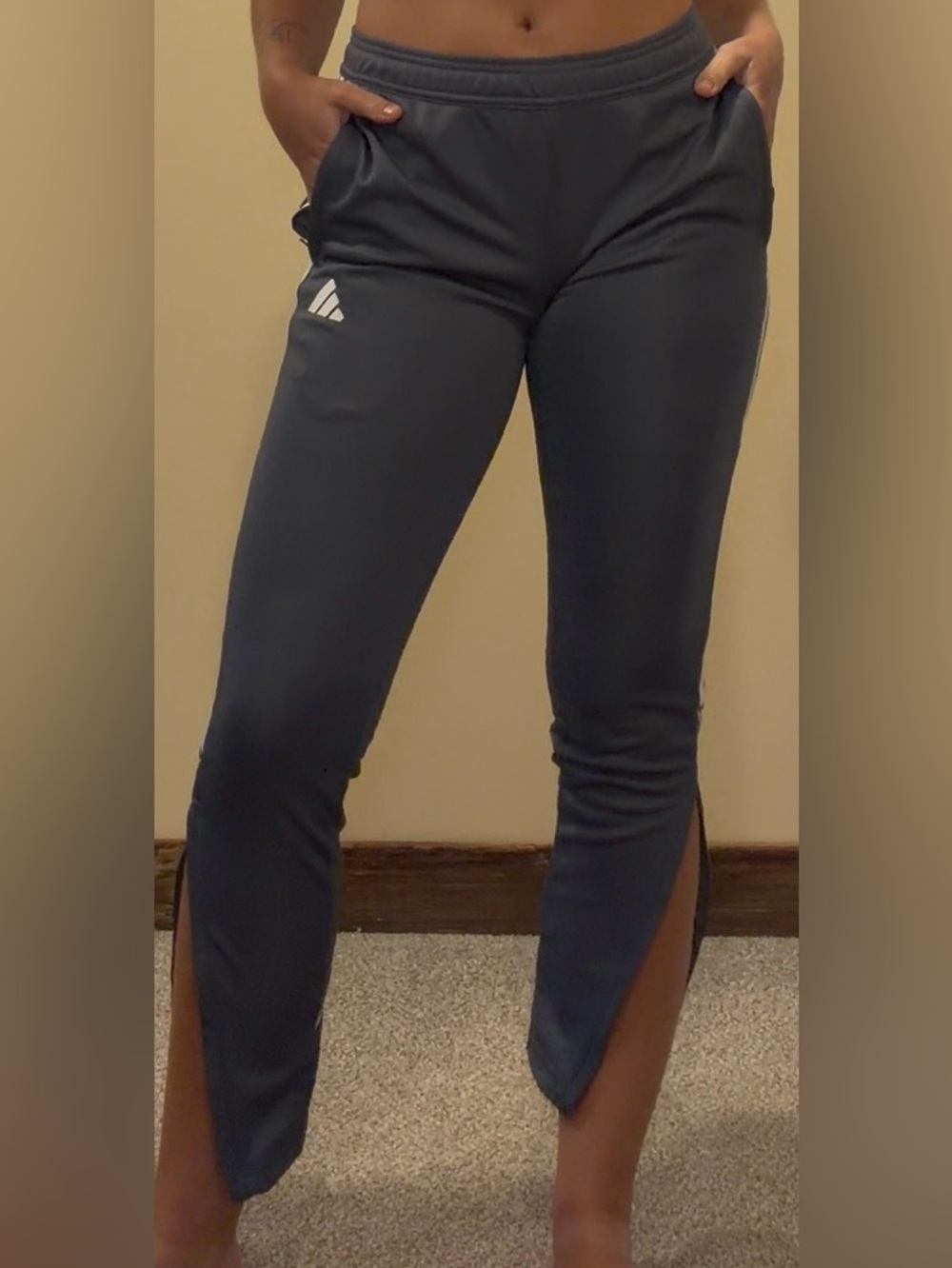 Adidas dark navy skinny track pant with side zippers. Size small.